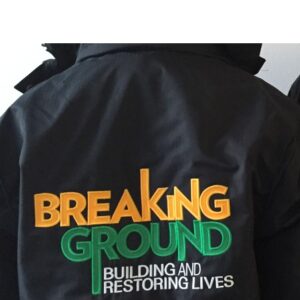 100-E-BREAKINGGROUNDback Embroider Breaking Ground Building and Restoring Lives Logo, Full Back 10W x 6.13T (FOR J302 HERRINGBONE PARKA ONLY)
